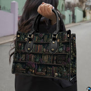Angled view displaying the dark academia library shelf print across the structured handbag.