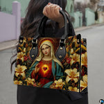 Model holding the Virgin Mary golden lily handbag while walking outdoors on street