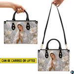 Back view of Madonna handbag featuring coordinated ethereal light beams and floral design