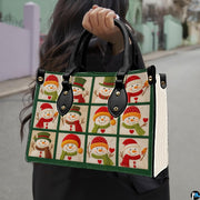 Handheld view of snowman patchwork handbag showing proportions, black top handles, and textured white sides.