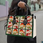 Handheld view of snowman patchwork handbag showing proportions, black top handles, and textured white sides.