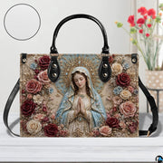 Front studio view of baroque Virgin Mary handbag showing ornate floral details and texture swatch