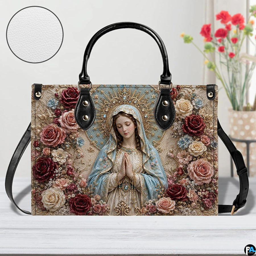 Front studio view of baroque Virgin Mary handbag showing ornate floral details and texture swatch