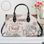 Jesus line art handbag on white table beside floral bouquet with texture swatch inset.