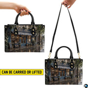 Top-down view of the handbag highlighting clean upper lines and dual carrying handles.