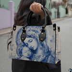 Lifestyle model carrying the blue Madonna and Child devotional handbag on street