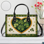 Front view of clover heart handbag with dark green botanical borders