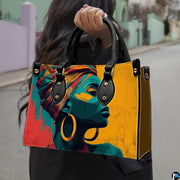 Handbag held outdoors showing colorful pop art portrait graphic