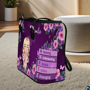 Perspective view of the Purple Floral Clinician Handbag standing on a light carpeted surface.