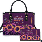 Front view of purple sunflower leopard handbag and matching zip wallet on solid white background