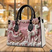 Angled tabletop view of the embossed pink Santa sleigh handbag.