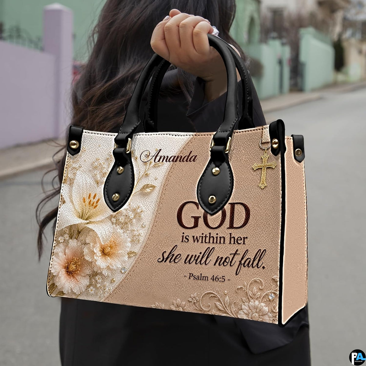 Model carrying structured sculpted lily and scripture handbag outdoors