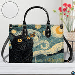 Close studio perspective of starry night cat art positioned on white surface beside flowers.