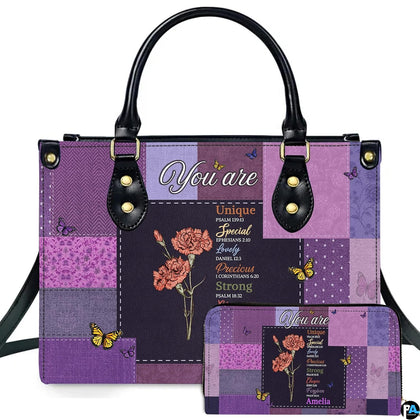Front view of purple patchwork handbag and matching wallet with carnation flowers and butterfly print.