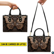 Carrying options demonstration illustrating handheld and shoulder wear for the bronze butterfly handbag.