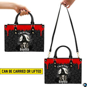 Dual view demonstrating top handle and long shoulder wear options with gothic sorceress illustration.