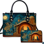 Front view of Bethlehem nativity scene handbag and matching wallet set with holy manger artwork