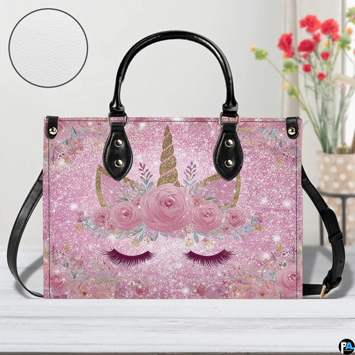 Angle perspective view of the unicorn handbag highlighting the sparkling pink print.