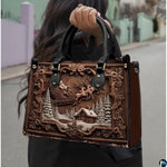 Handbag with carved wood Santa Claus sleigh artwork carried outdoors by top handles