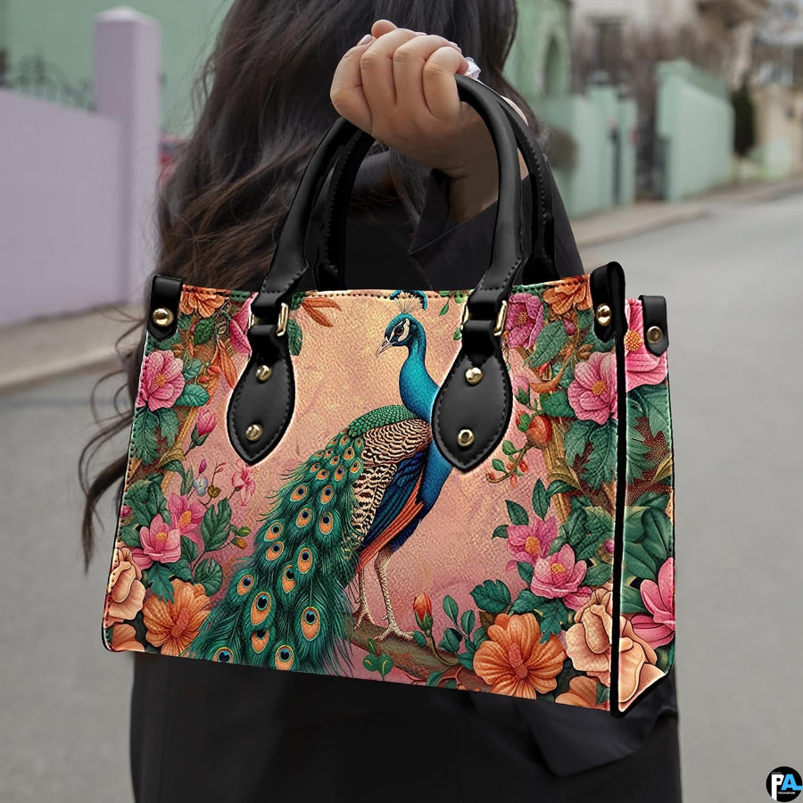 Woman carrying a pink floral peacock handbag by the top handles