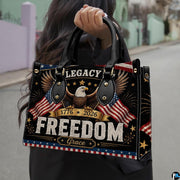 Perspective display of patriotic eagle and flag handbag and wallet pair