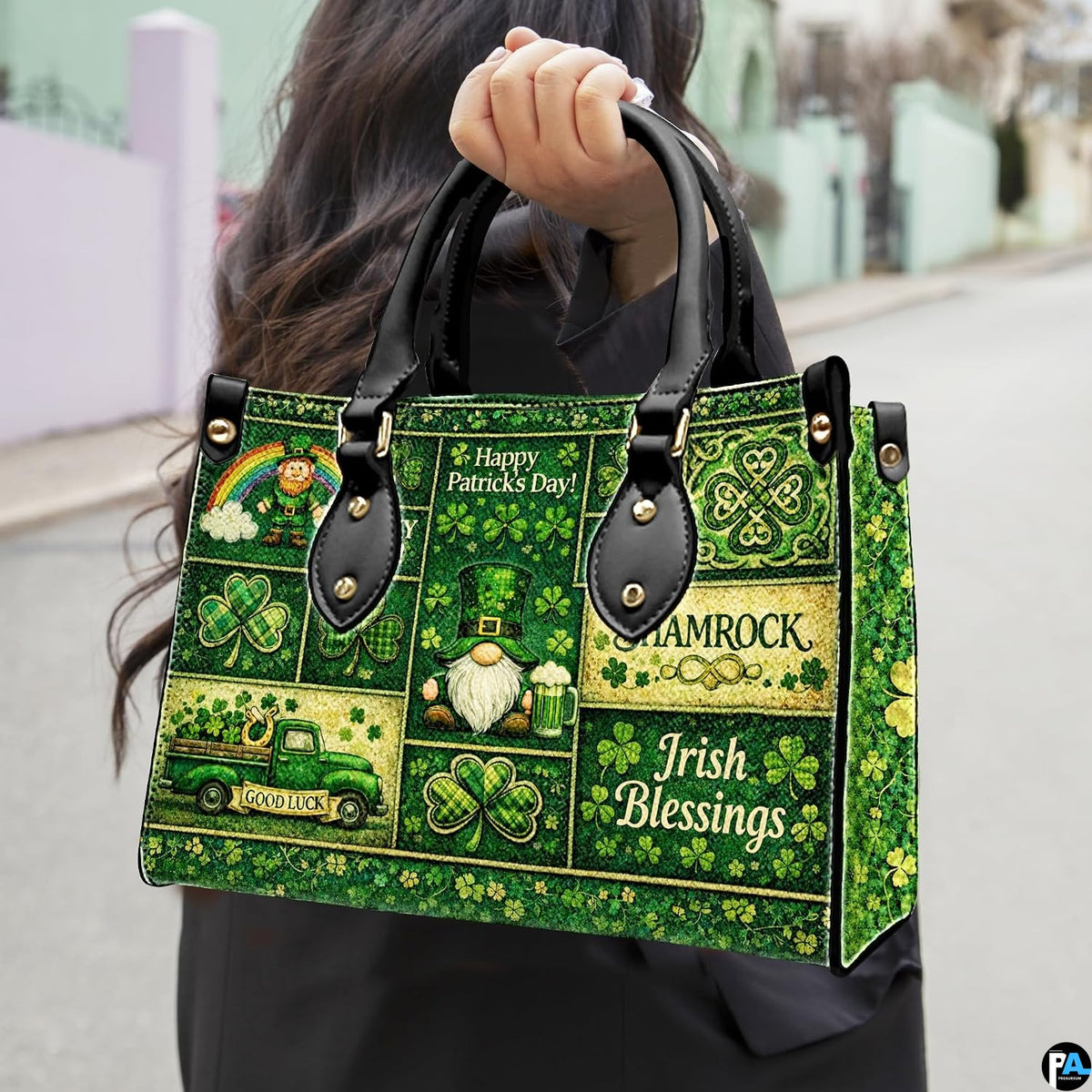 Model carrying green clover collage handbag with folklore motifs