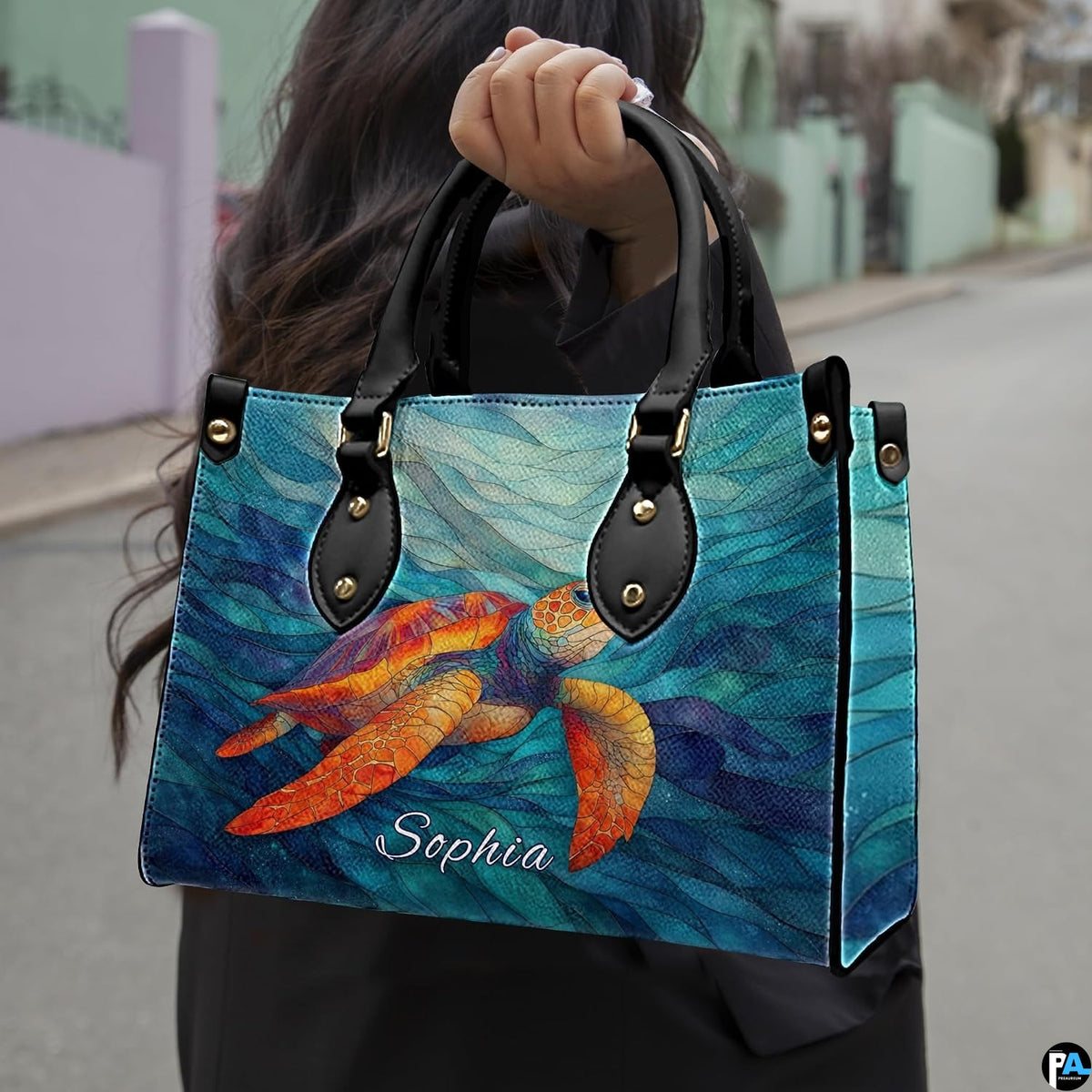 Front angled view showing the bright orange mosaic turtle gliding across cyan wave ribbons.
