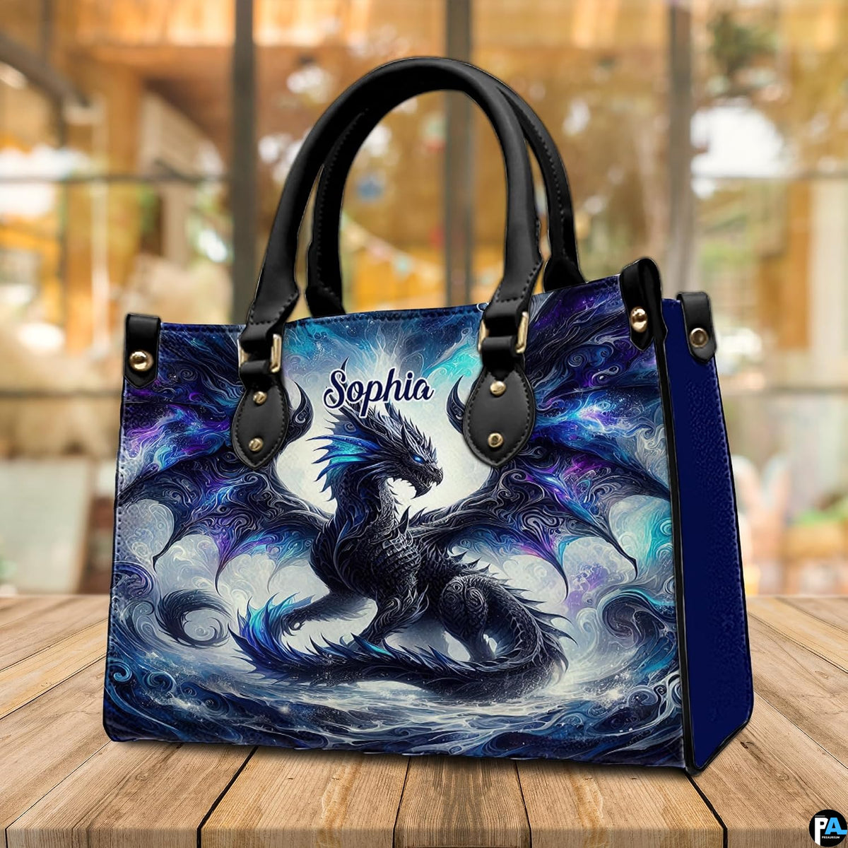 Cosmic shadow dragon handbag displayed on rustic wooden table in cafe setting.