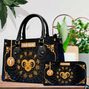 Front view of golden zodiac ram handbag showing central ram head and celestial constellation chart.