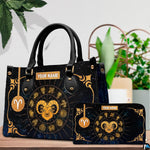 Front view of golden zodiac ram handbag showing central ram head and celestial constellation chart.