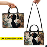 Reading silhouette handbag on plain background with circular inset material texture detail swatch.