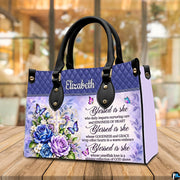 Floral cross handbag displayed on wooden tabletop in front of sunlit cafe window.