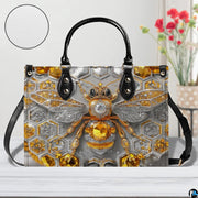 Matching bee wallet lying flat displaying the coordinating geometric honeycomb bee motif.