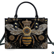 Back view of bee handbag displaying continuous black background with golden scroll motifs.