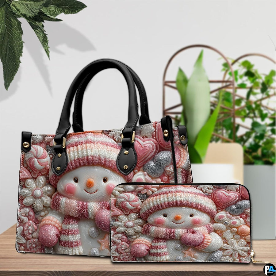 Tabletop presentation showing the pink candy snowman design beside lush decorative green leaves