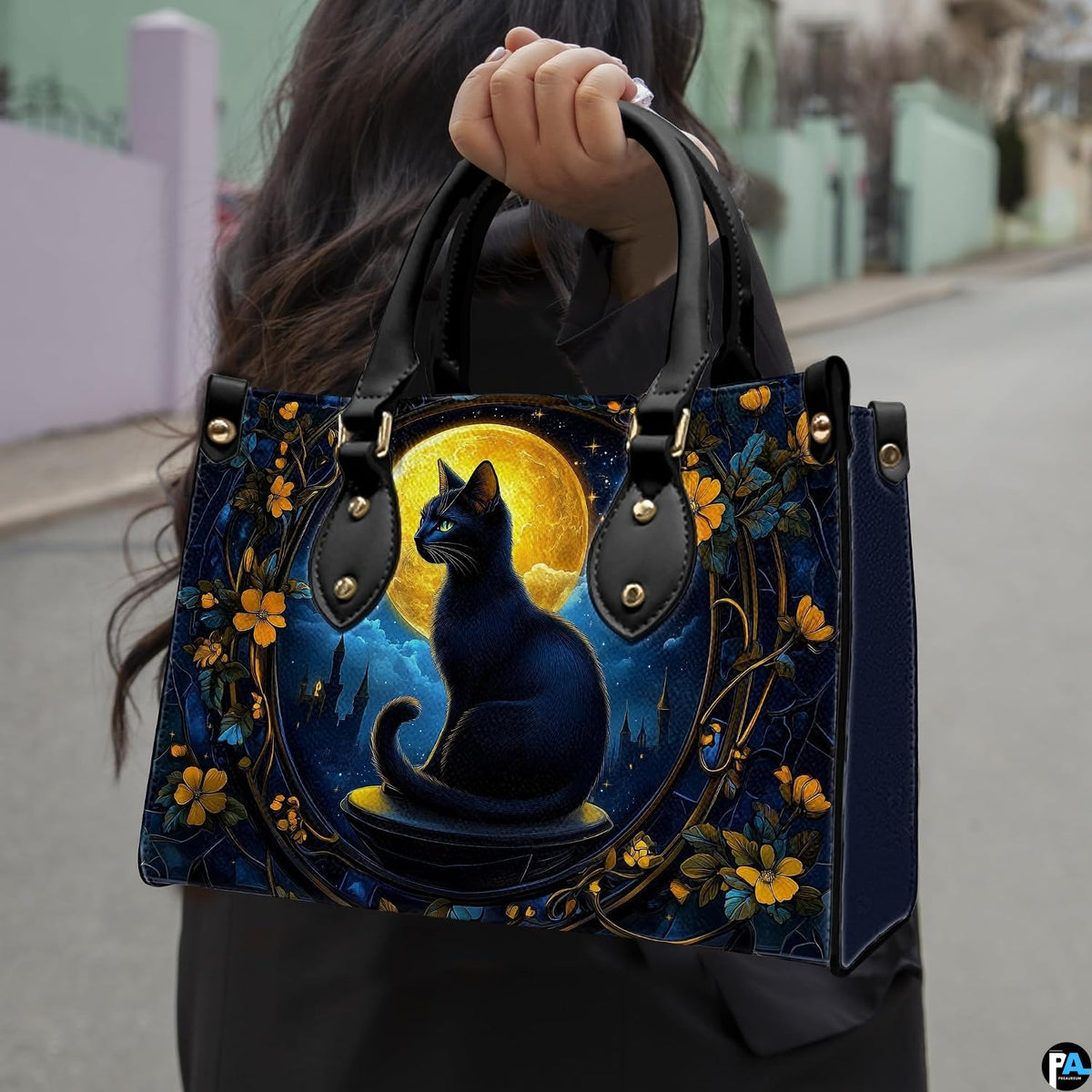Outdoor view showcasing gothic black cat artwork held alongside an urban walkway.