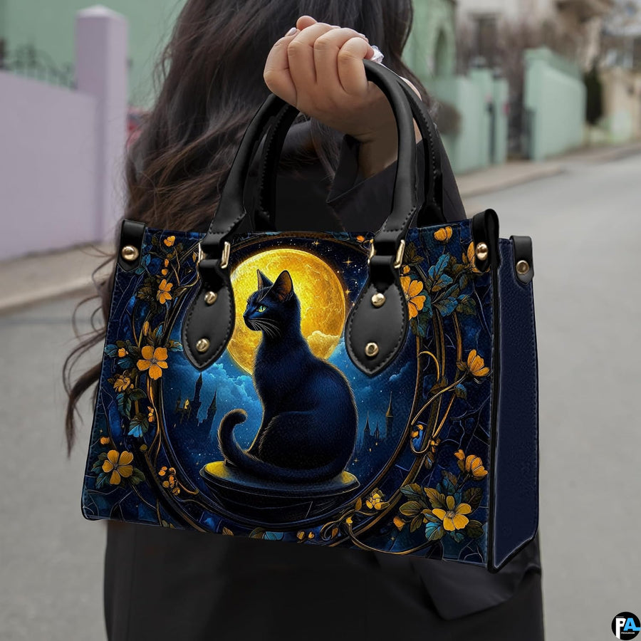 Outdoor view showcasing gothic black cat artwork held alongside an urban walkway.