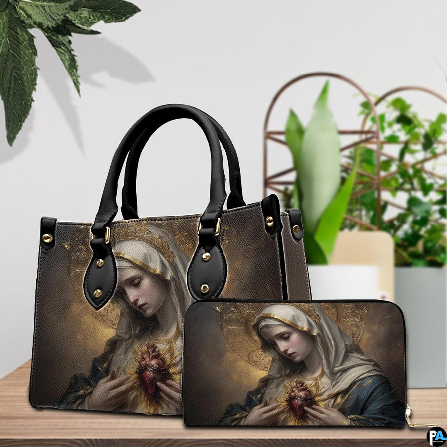 Immaculate Heart of Mary handbag and wallet set arranged on wooden table with green plants