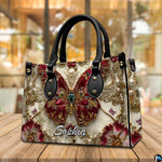Alternative angle display of baroque ruby butterfly handbag and wallet set