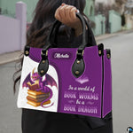Product diagram highlighting handle buckles, removable shoulder strap, zipper pull, and lining.
