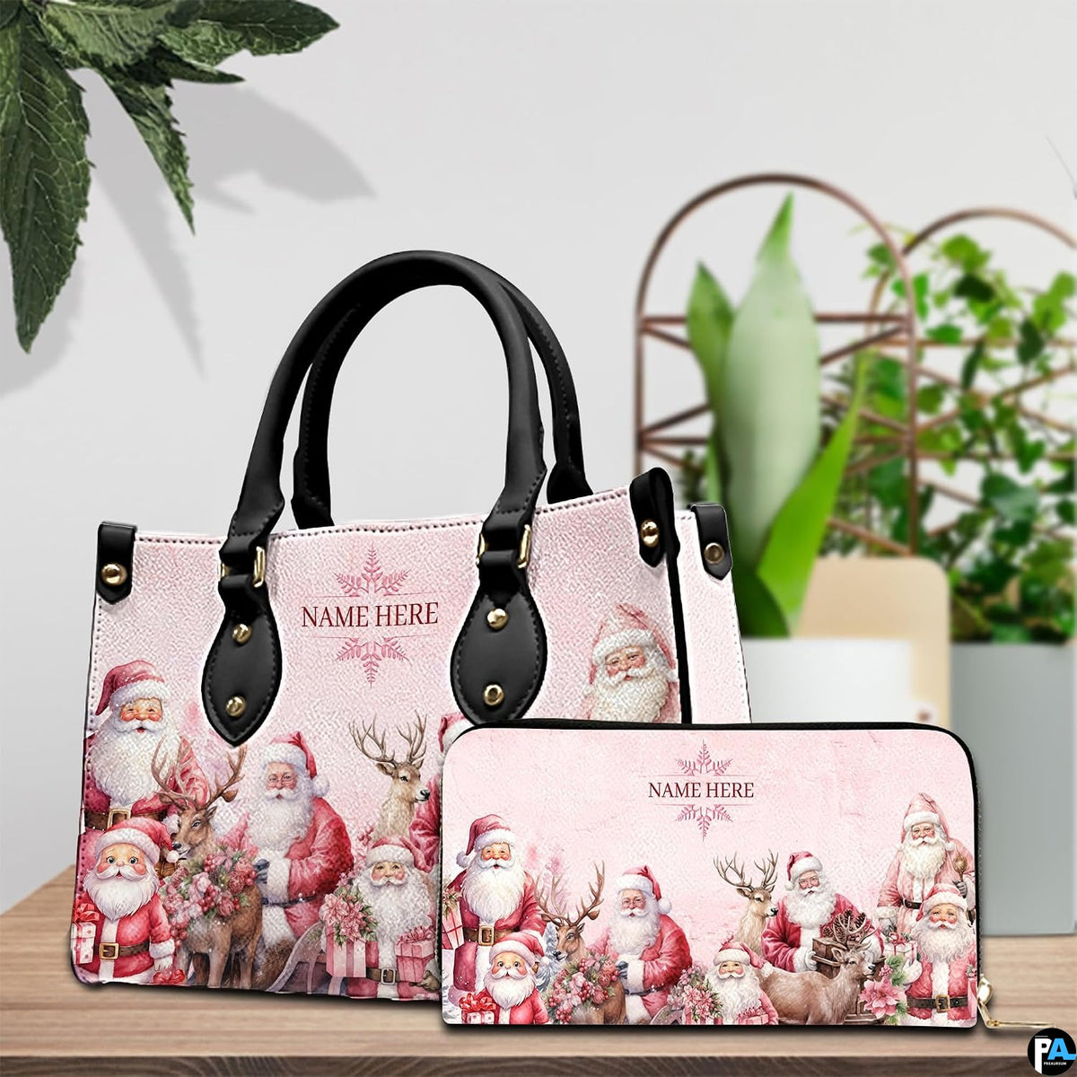 Handbag and matching zip wallet set displayed on wooden tabletop surrounded by green plants.
