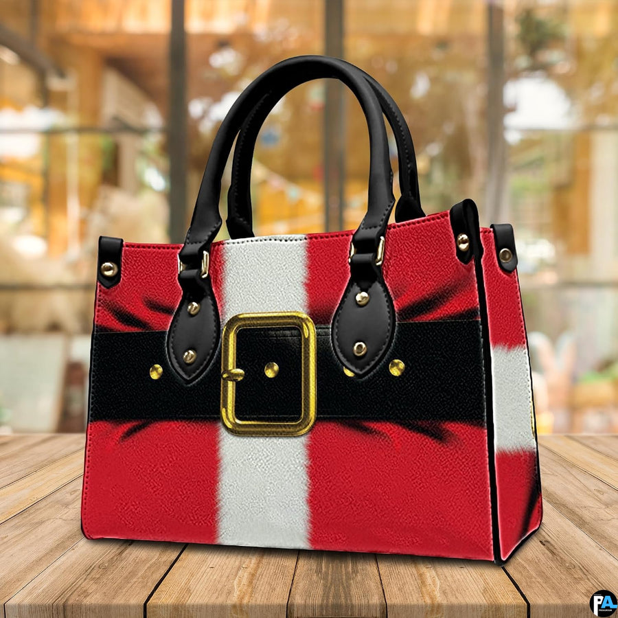 Tabletop perspective of Santa suit holiday handbag showing dimensional coat shading and black belt graphic.