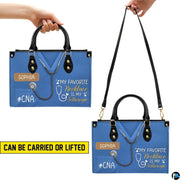 Side profile view of handbag showcasing continuous solid royal blue print