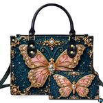 Studio presentation showing baroque teal jewel butterfly artwork alongside matching companion on white surface.