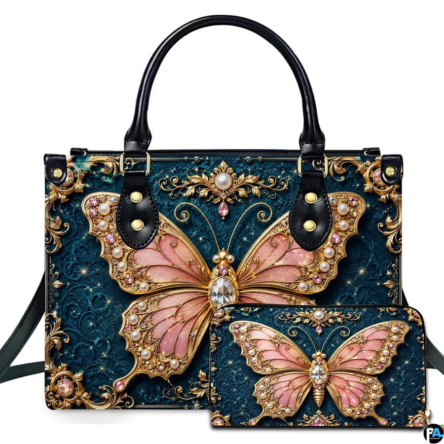 Studio presentation showing baroque teal jewel butterfly artwork alongside matching companion on white surface.