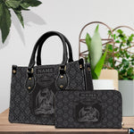 Dragon crest handbag and wallet displayed on wooden table before indoor plants.
