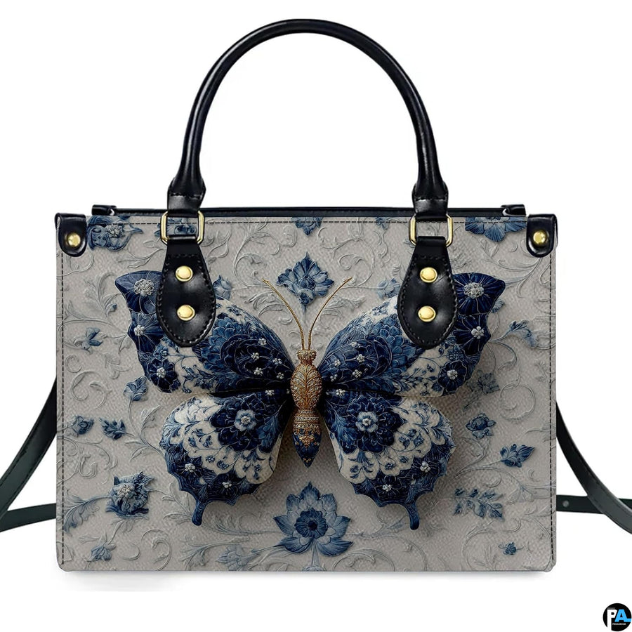 Model carrying blue porcelain butterfly handbag and matching wallet demonstrating scale
