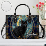 Studio presentation of celestial stained glass black cat and crescent moon artwork.