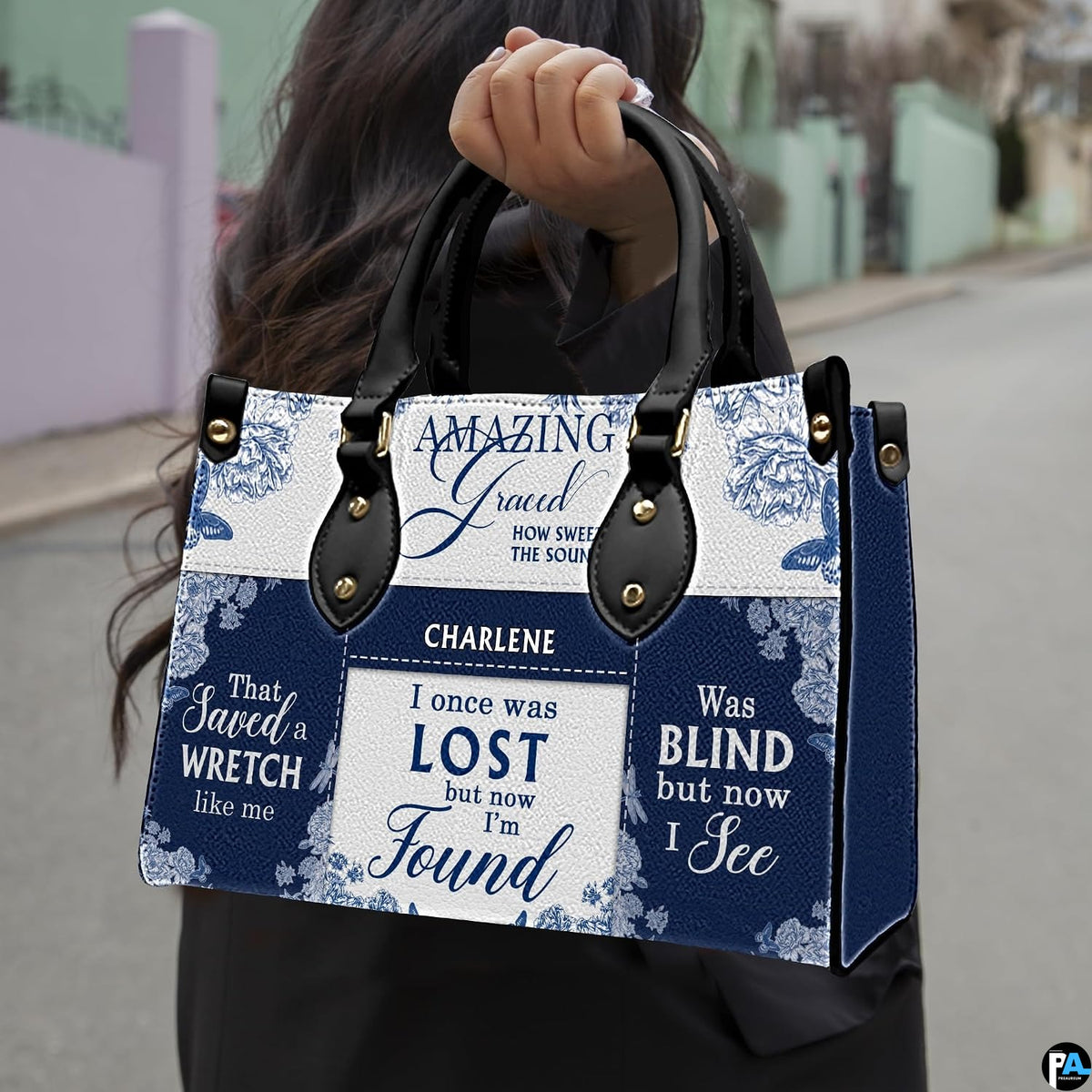 Model outdoors carrying blue porcelain floral hymn handbag