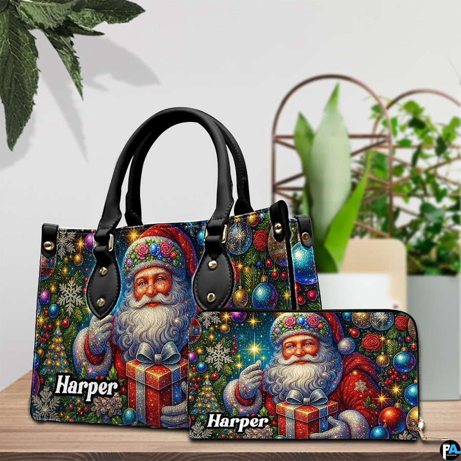Handbag and matching wallet set with vintage Santa artwork displayed on wooden table with plants.